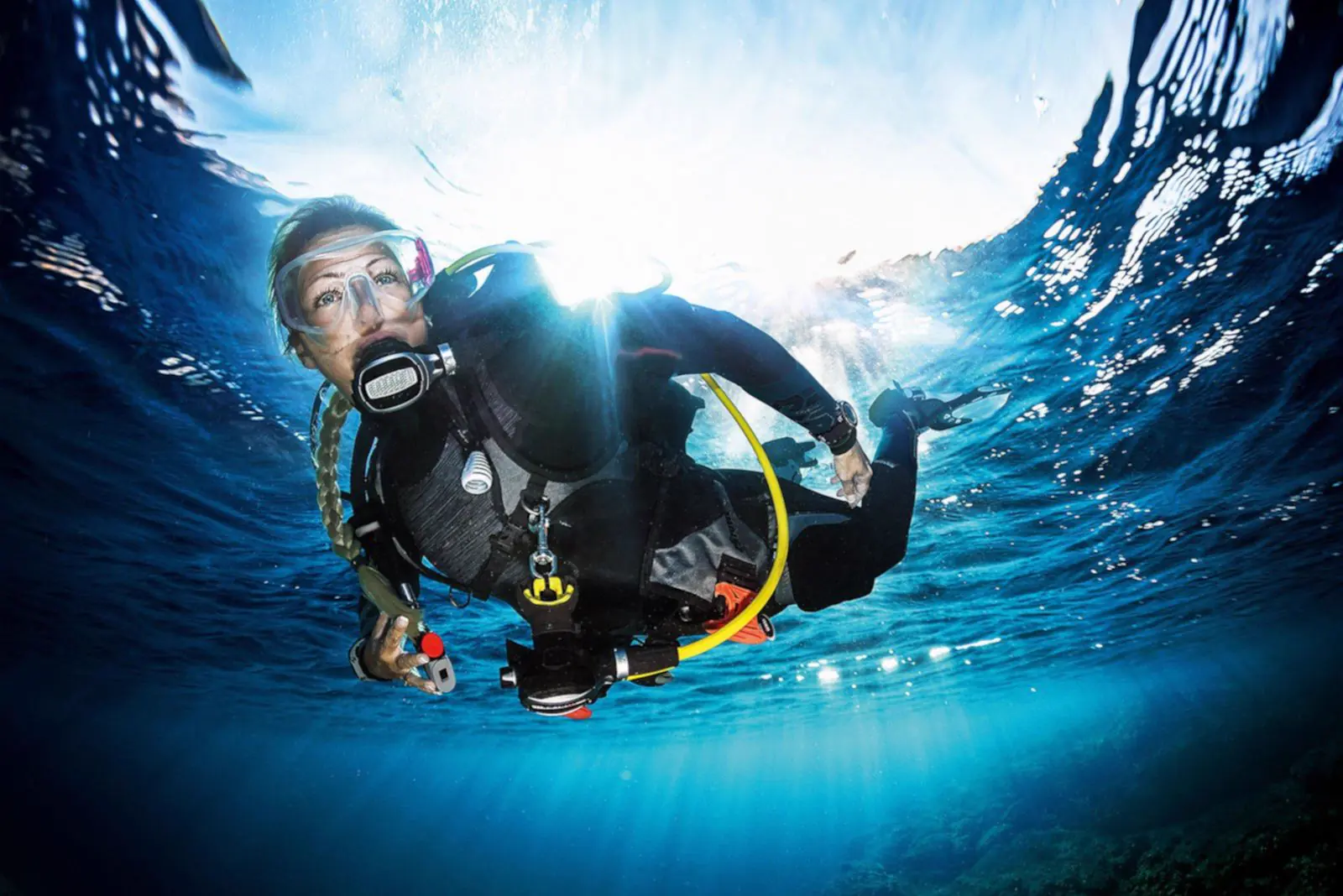 Diver in blue water